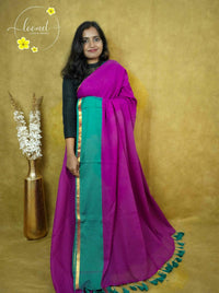 ASB25635 Magenta and Sea Green Mul-Cotton saree with plain body pattern.