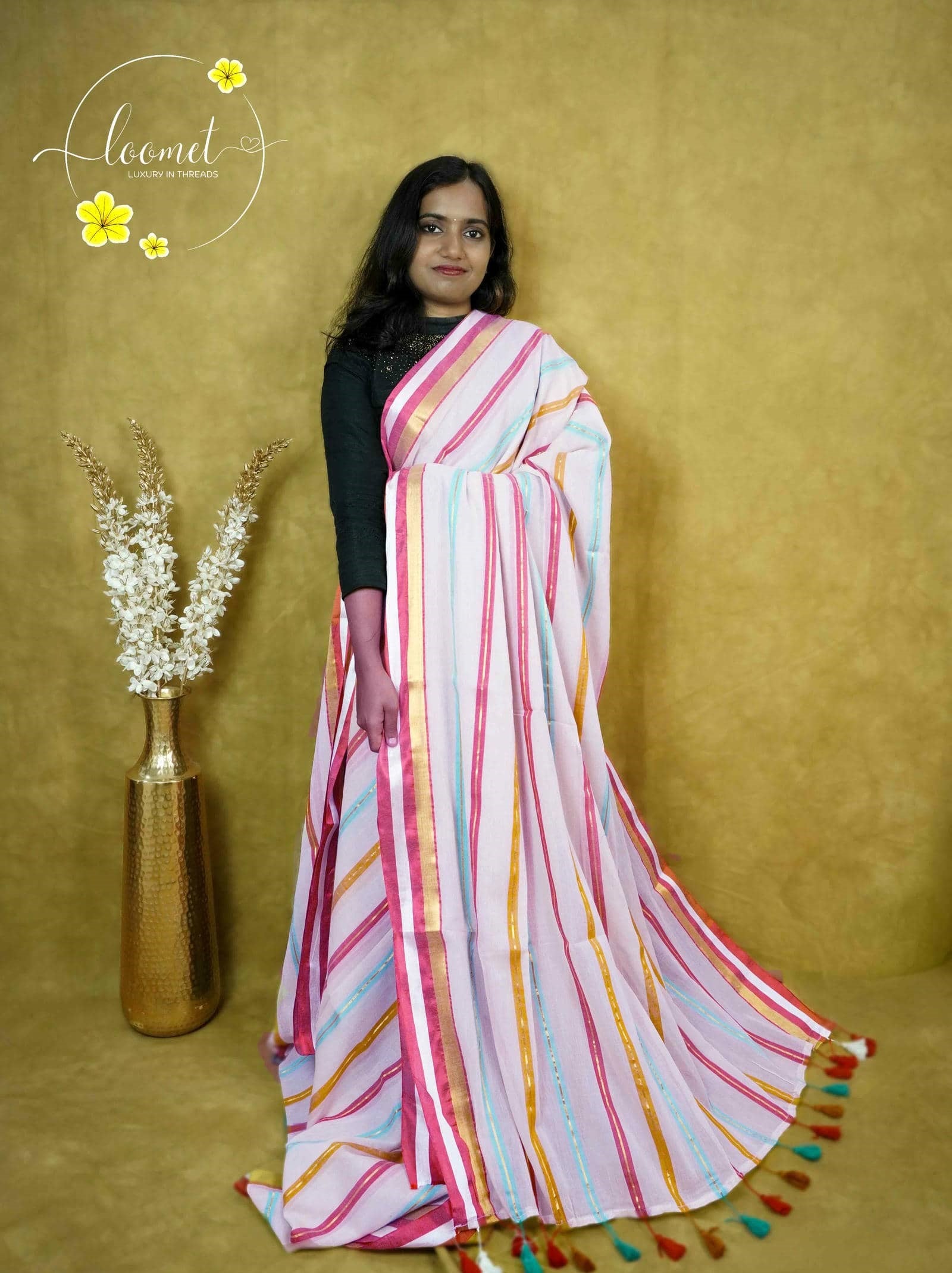 ASB25637 Off-White saree with a vibrant bold multi-coloured vertical stripe design red, gold, yellow, and aqua blue and finished with multi-coloured tassels.