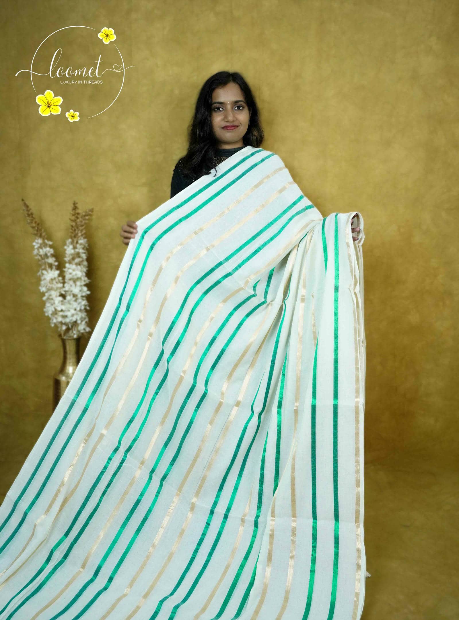 ASB25638 White saree with a minimalist design & vertical stripes in emerald green and soft beige finished with dual-coloured tassels.