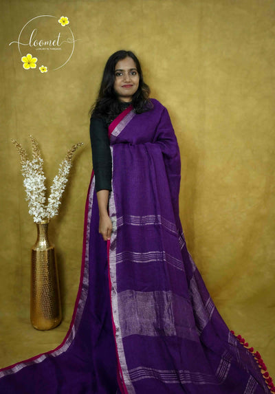 ASB2564 Royal purple saree with textured body featuring horizontal silver/pale gold stripes by a solid metallic vertical border and a vibrant rani pink edge.