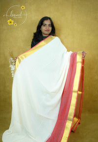 ASB25640 Off-White and Coral Red Mul-Cotton saree with plain body pattern.