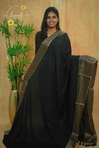 ASB25660 Matte Black Mul Cotton saree with vertical golden zari stripes.