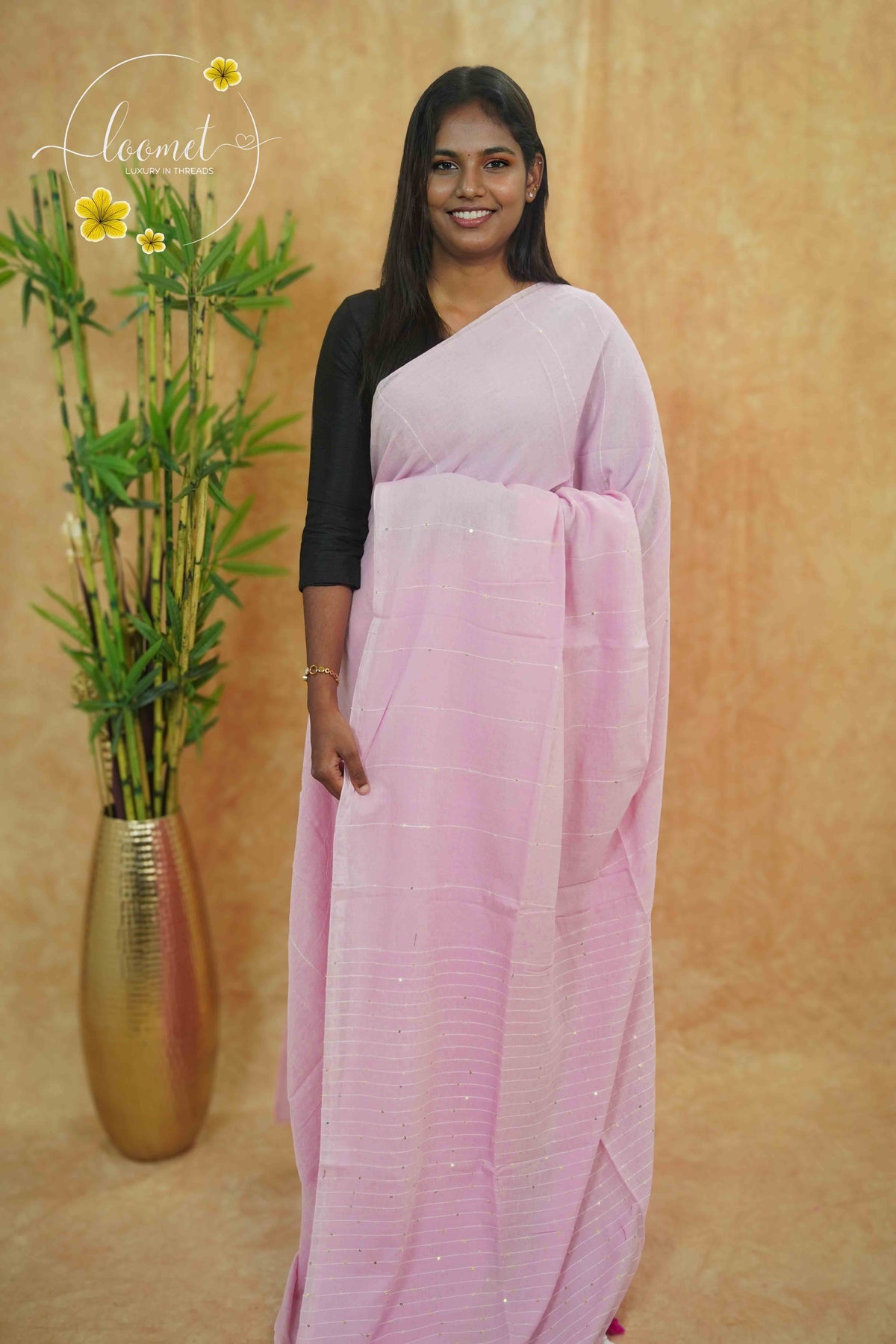 ASB25674 Baby Pink Mul Cotton saree with striped texture, shimmering silver sequins.