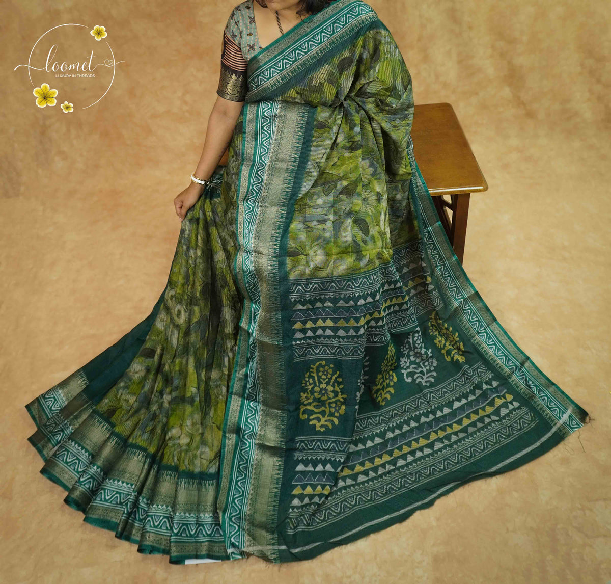 ASM1732 Moss Green Viscose saree features a subtle floral-shadow print with zari border.