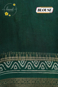 ASM1732 Moss Green Viscose saree features a subtle floral-shadow print with zari border.