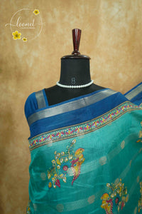 ASM2332 Teal Green & Imperial Blue Viscose saree with multi-color kalamkari buttas.