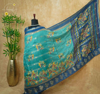 ASM2332 Teal Green & Imperial Blue Viscose saree with multi-color kalamkari buttas.