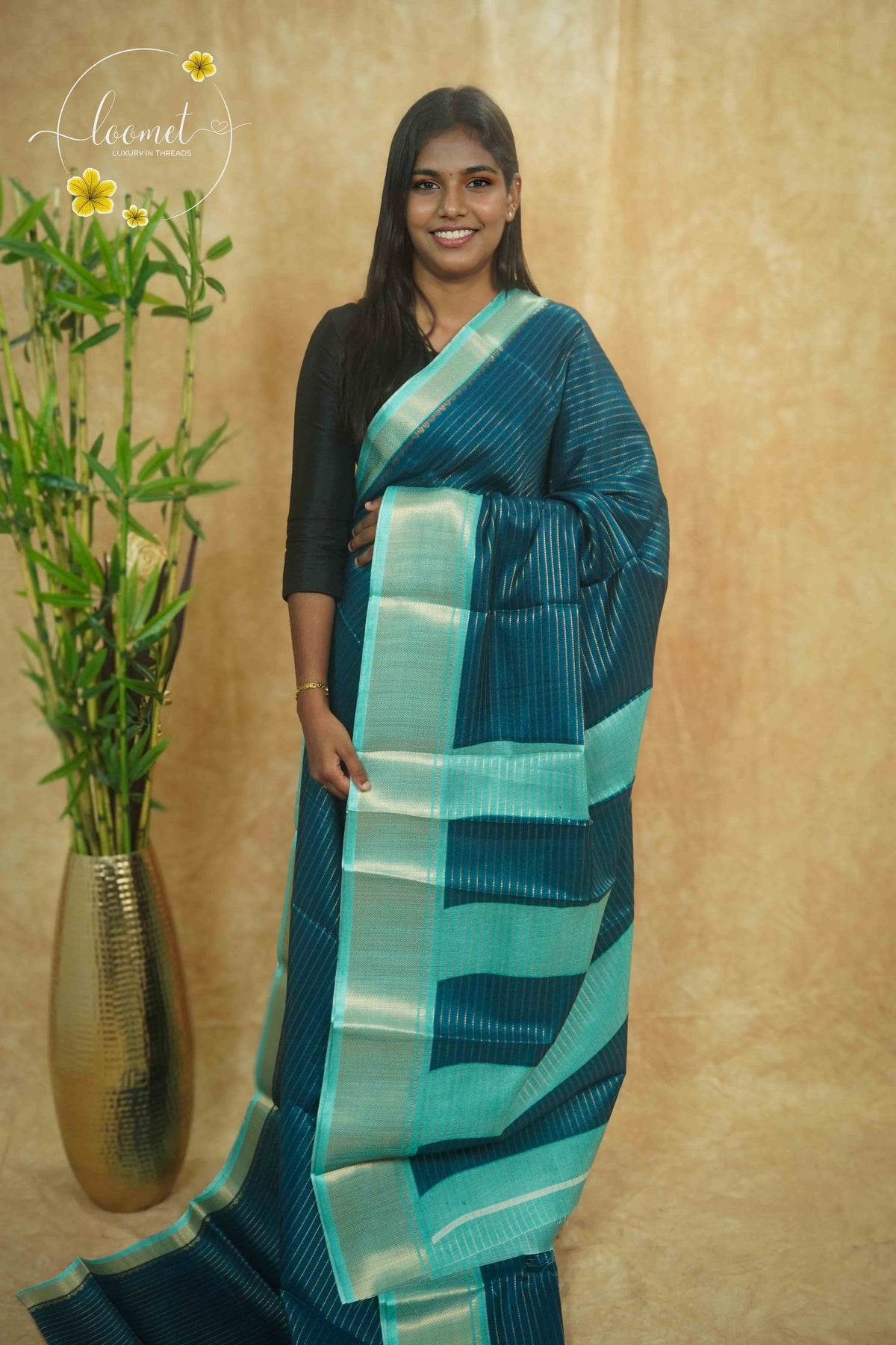 AVD5438 Peacock Blue Dola Silk saree with horizontal silver pinstripes.