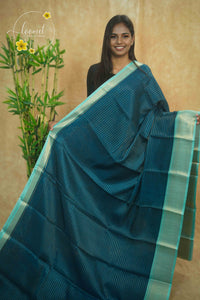 AVD5438 Peacock Blue Dola Silk saree with horizontal silver pinstripes.