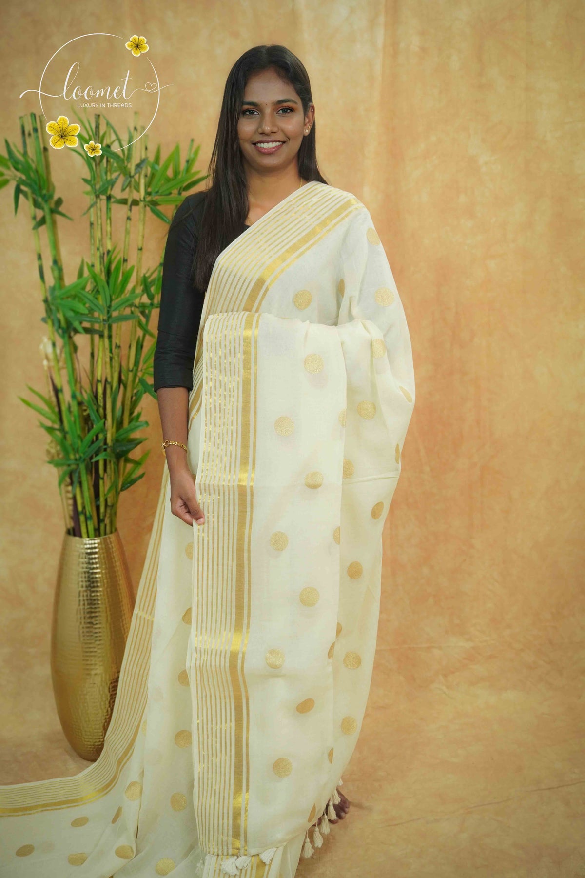 AWB7120 Off-White Mul Cotton saree features large golden zari coin buttas.