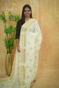 AWB7120 Off-White Mul Cotton saree features large golden zari coin buttas.