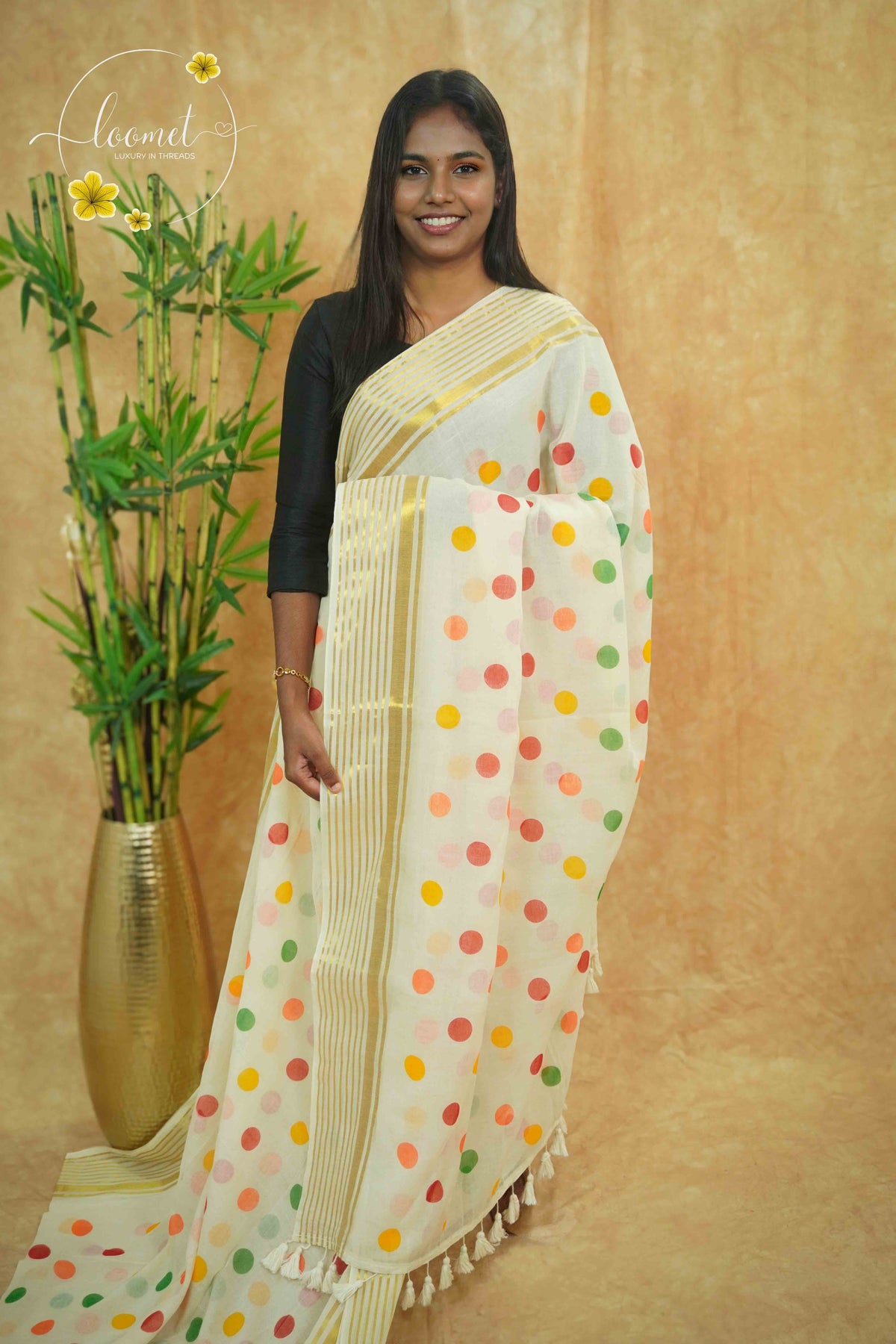 AWB7121 Off-white Mul Cotton saree features Multicolor Polka Dots.