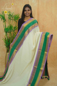 AWB7220 Off-White mul cotton saree features a plain body Tri-color border.