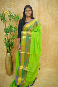 AWB7230 Parrot Green mul cotton saree features a plain body with lavender and golden zari striped border.