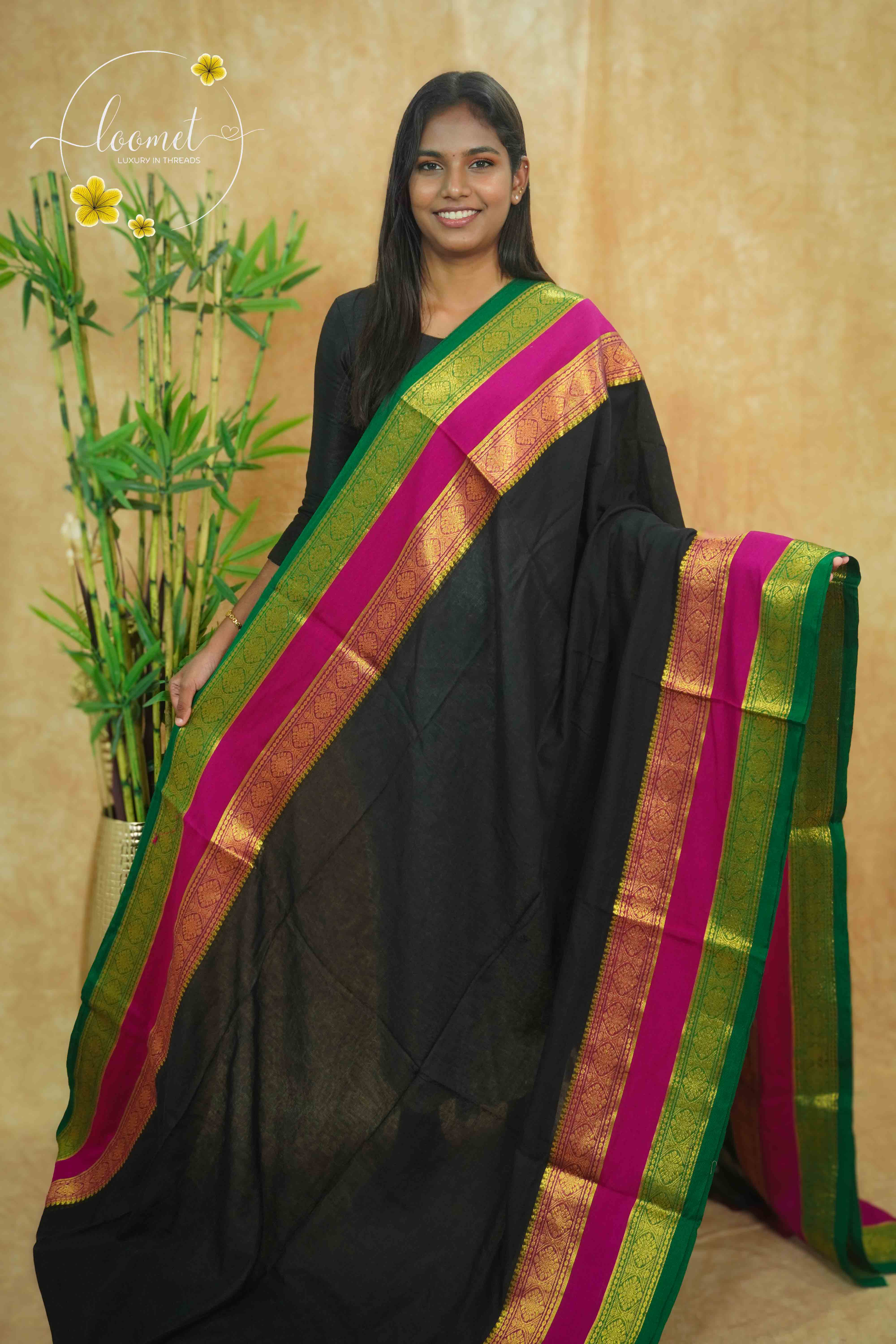 AWB7270 Black mul cotton saree features a plain body with Tri-colour border.