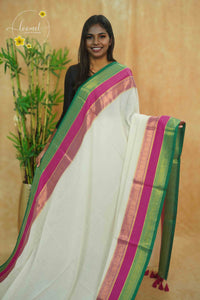 AWB7280 Off-White mul cotton saree features a plain body with golden zari and tassels.