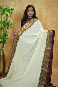 AWB7290 Off-White mul cotton saree features a plain body with wine & golden zari and tassels.