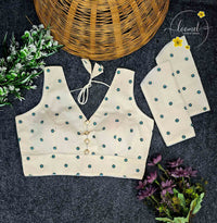 BLB1411 Off-white colour blouse features a delicate teal floral buttis pattern.