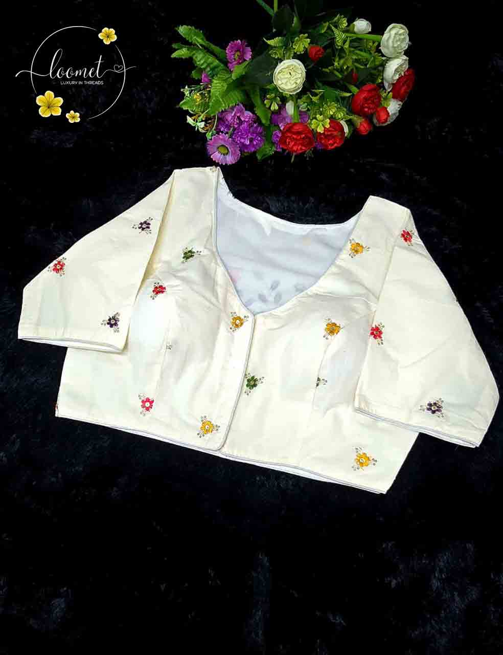 BLB1711 Off-white colour blouse features a delicate floral in pink, blue, red, and yellow embroidery pattern.