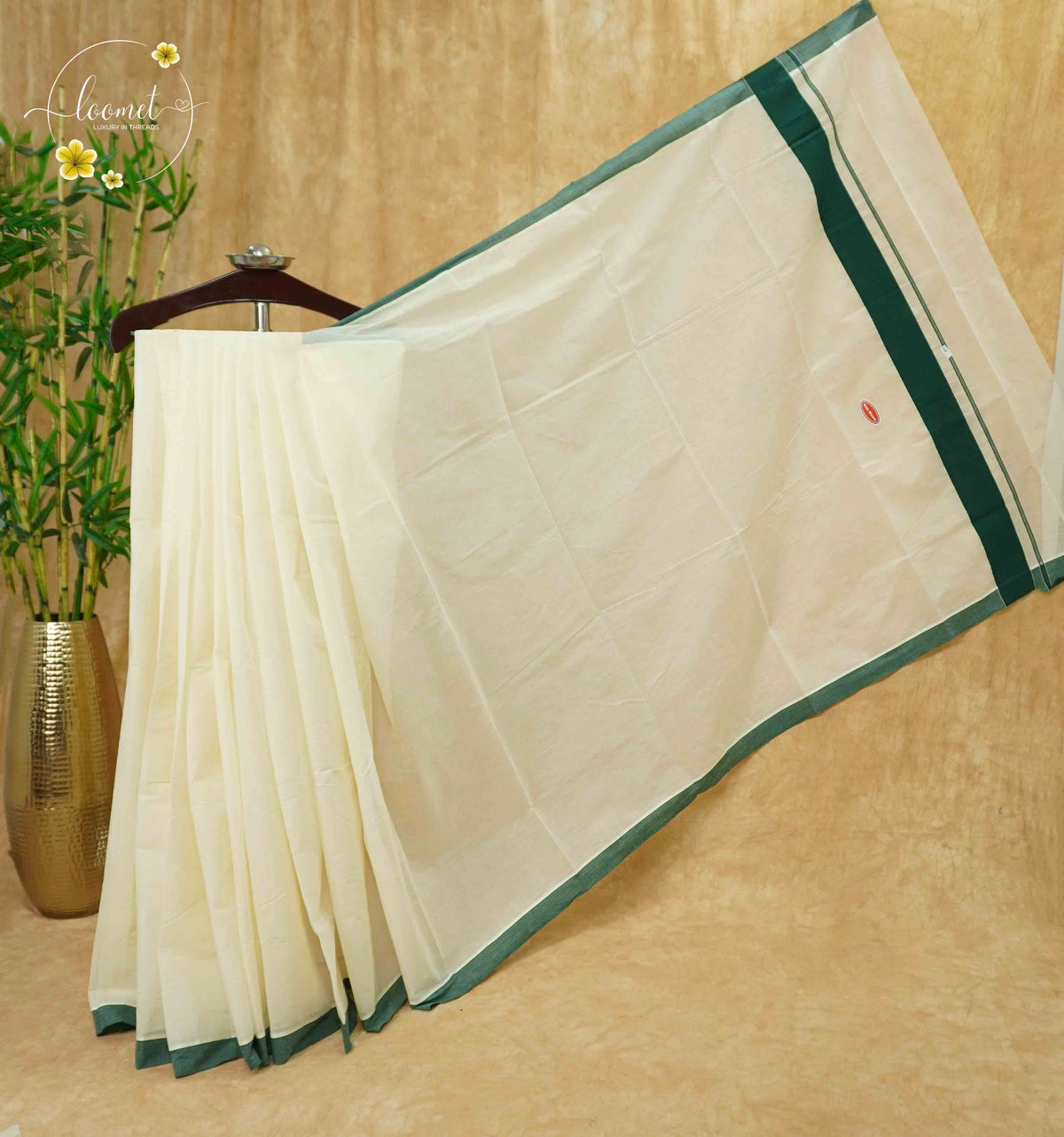 CKS5313 Off-White Cotton saree with bottle green border.
