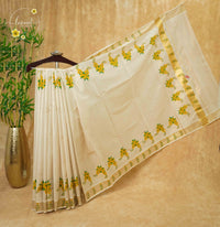 CKS5511 Light Gold Tissue Cotton saree featuring hand-painted kanikkonna floral bunches.