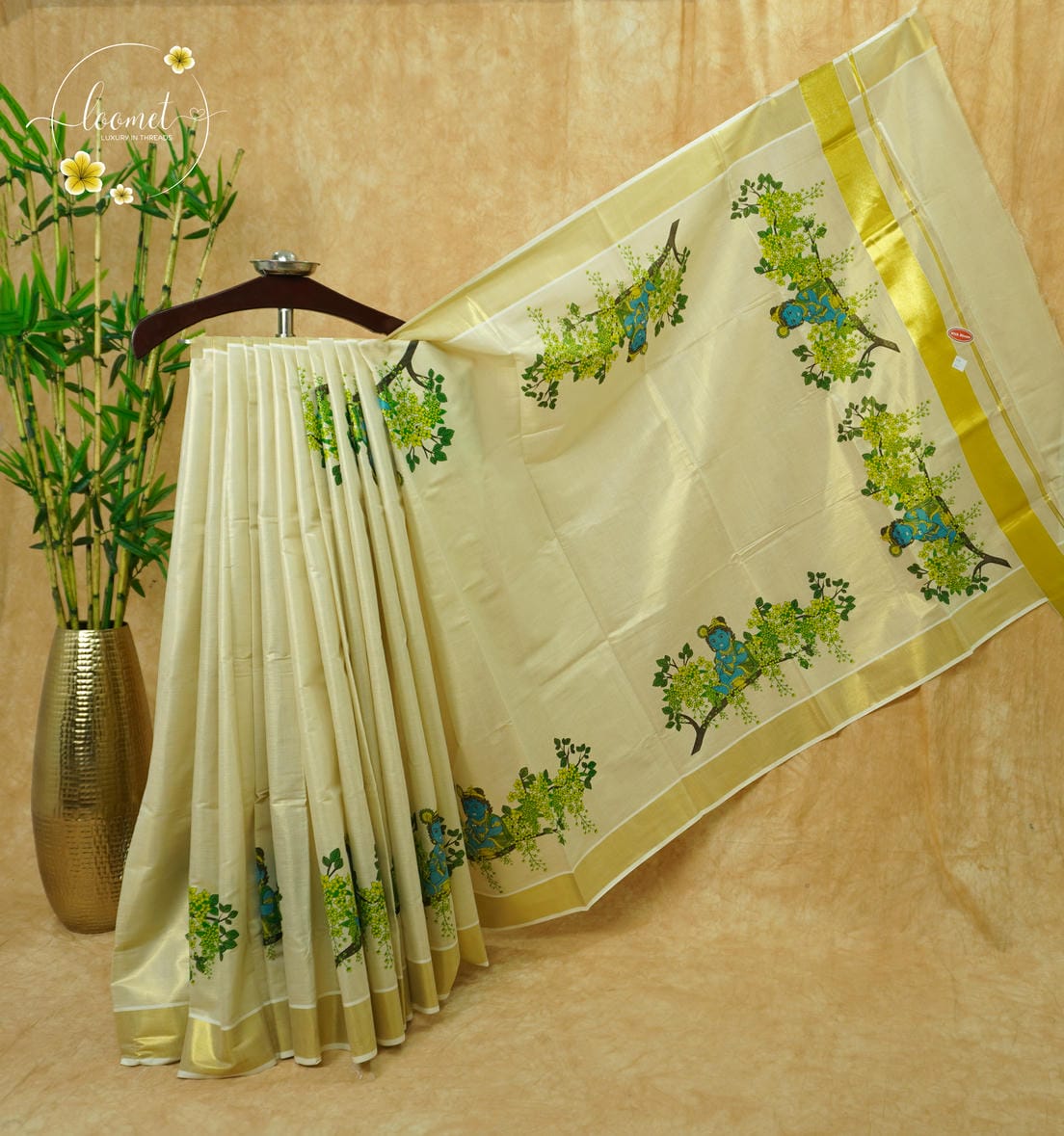 CKS5911 Off-White Tissue Cotton saree featuring Krishna mural prints, golden Kanikkonna blossoms with gold zari border.