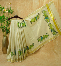 CKS5911 Off-White Tissue Cotton saree featuring Krishna mural prints, golden Kanikkonna blossoms with gold zari border.