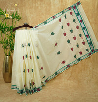 CKS6071 Off-White Cotton saree featuring emerald green and magenta leaf-shaped butta prints with silver zari border.