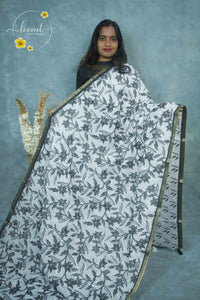 ICS1221 Black & White Linen-Cotton saree featuring floral and vine (bel) print.