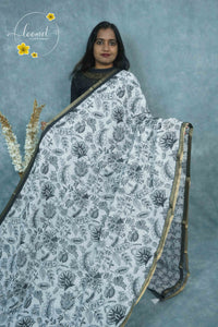 ICS1223 Black & White Linen-Cotton saree featuring floral & leafy vine print.