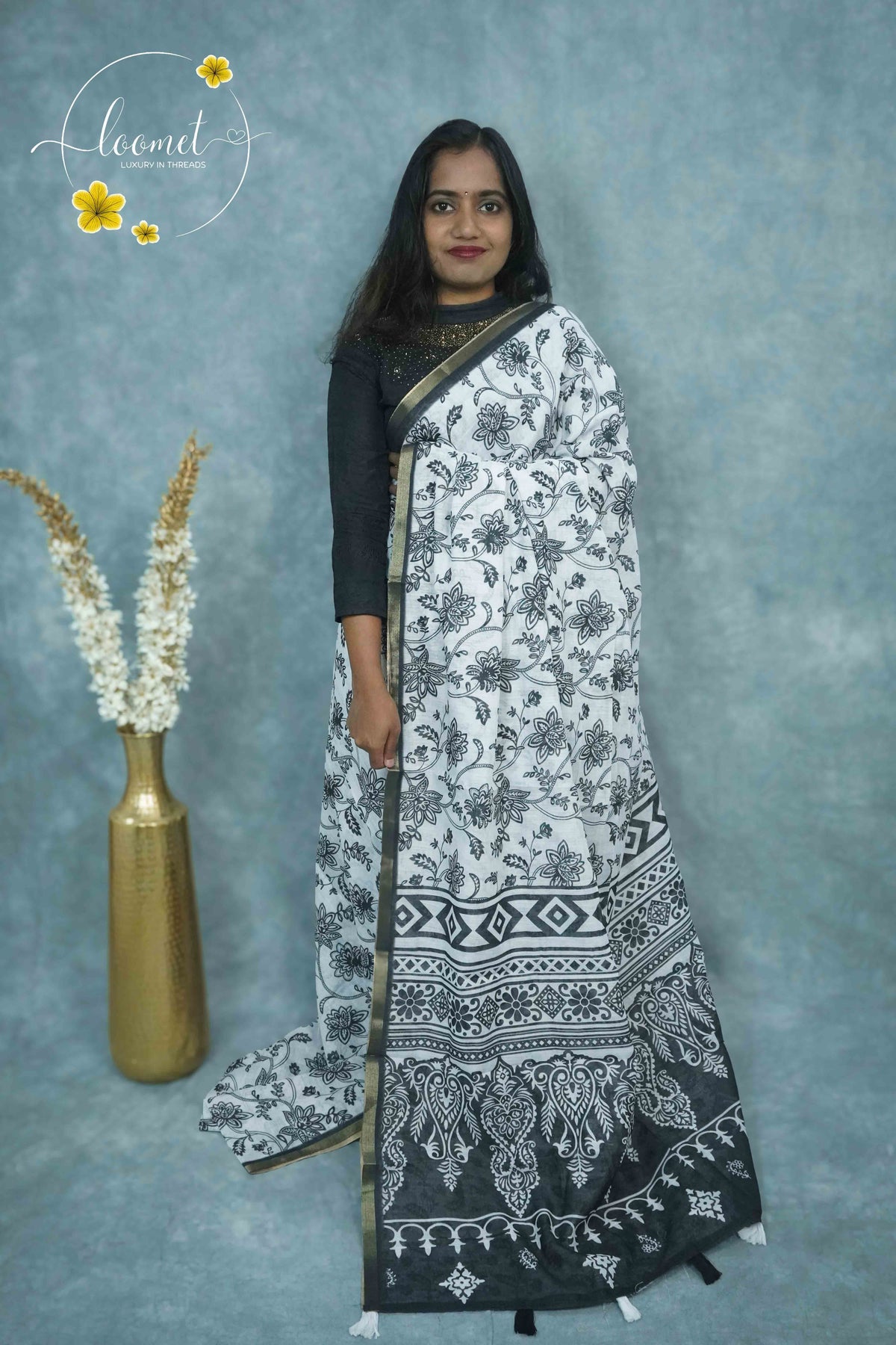 ICS1224 Black & White Linen-Cotton saree featuring floral and vine (bel) print.