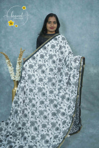 ICS1224 Black & White Linen-Cotton saree featuring floral and vine (bel) print.