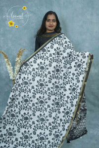 ICS1226 Black & White Linen-Cotton saree featuring lotus and vine (bel) print.