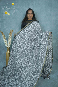 ICS1228 Black & White Linen-Cotton saree featuring swirling floral & foliage print.