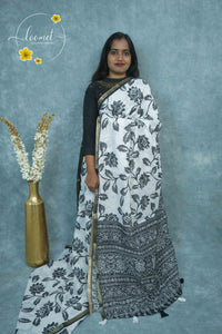 ICS1229 Black & White Linen-Cotton saree featuring lotus and foliage print.