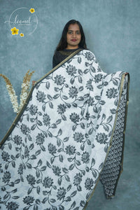 ICS1229 Black & White Linen-Cotton saree featuring lotus and foliage print.