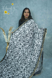 ICS1230 Black & White Linen-Cotton saree featuring floral and leafy vine print.