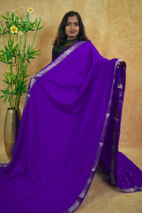 IMC5114 Electric Purple Georgette Viscose saree with horizontal gold zari stripes.