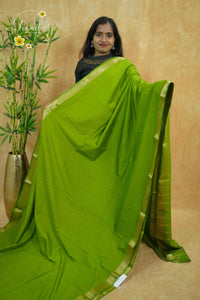 IMC5115 Parrot Green Georgette Viscose saree with horizontal gold zari stripes.