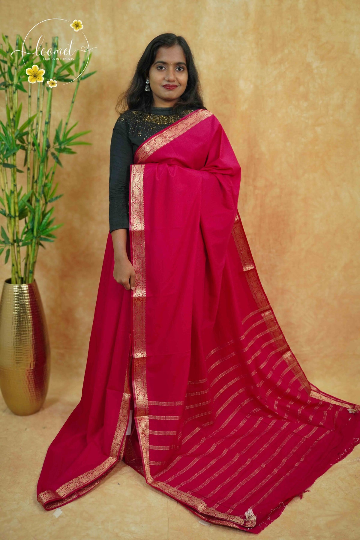 IMC5118 Pink Georgette Viscose saree with horizontal gold zari stripes.
