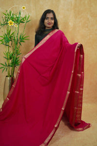 IMC5118 Pink Georgette Viscose saree with horizontal gold zari stripes.