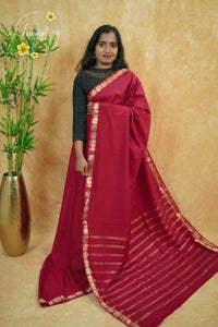 IMC7115 Maroon Georgette viscose saree with annapakshi motif and Gold Zari stripes.