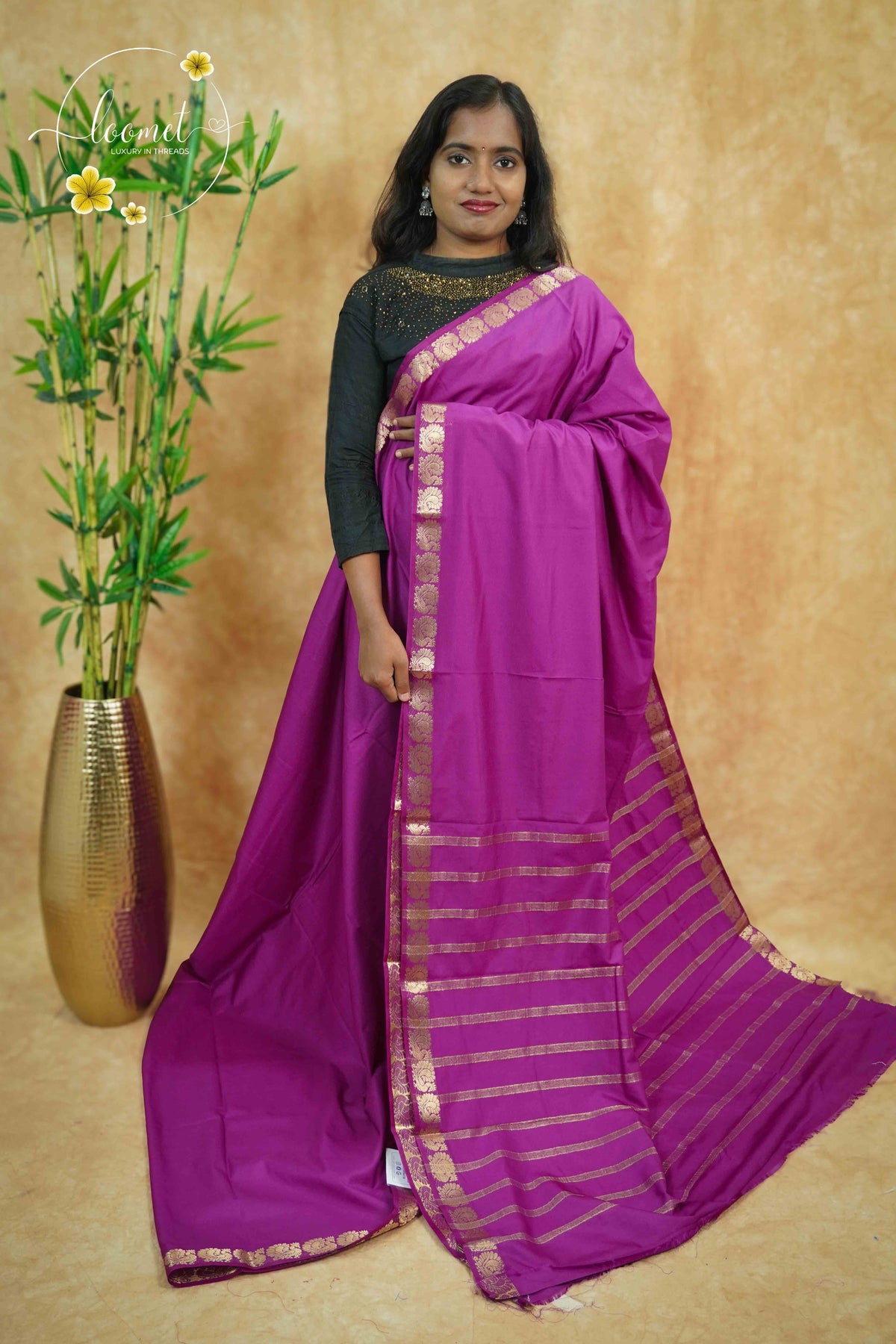 IMC7117 Magenta Georgette viscose saree with annapakshi motif and Gold Zari stripes.