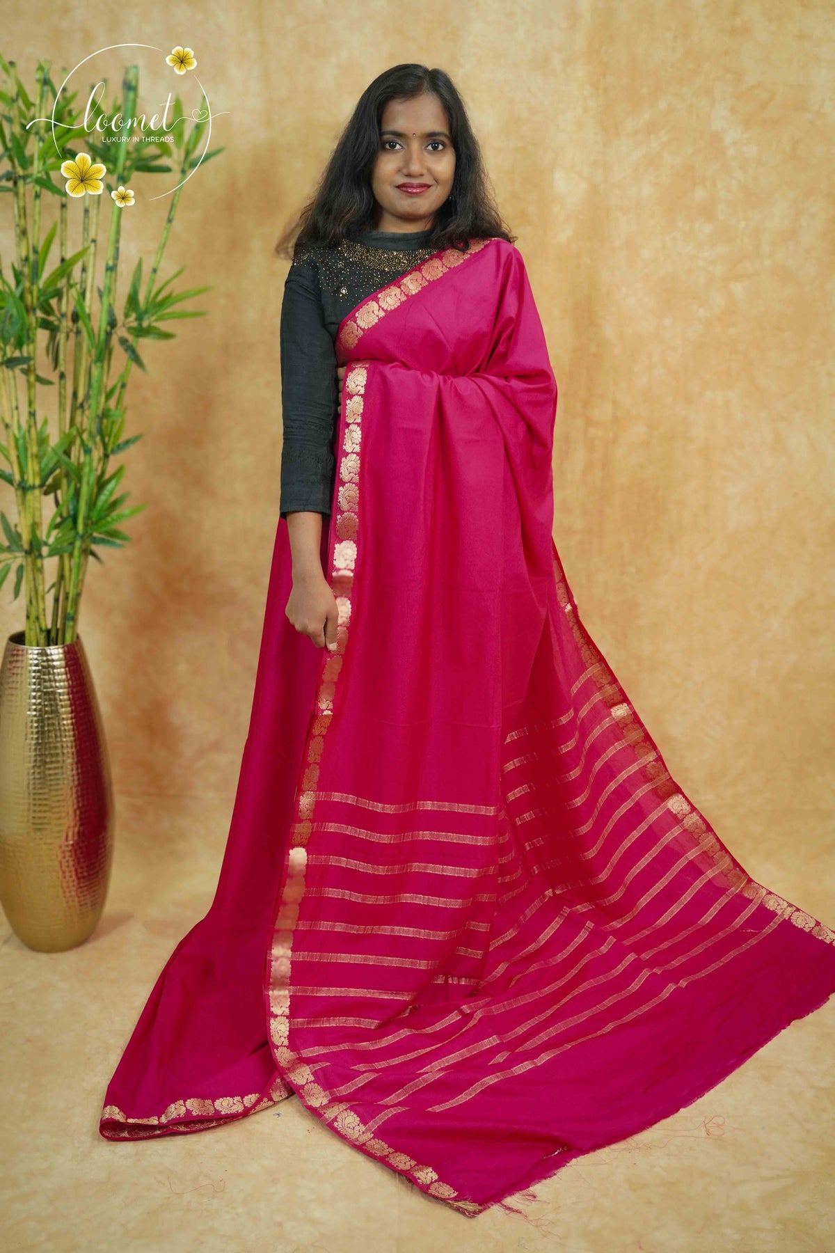 IMC7119 Rani Pink Georgette viscose saree with annapakshi motif and Gold Zari stripes.