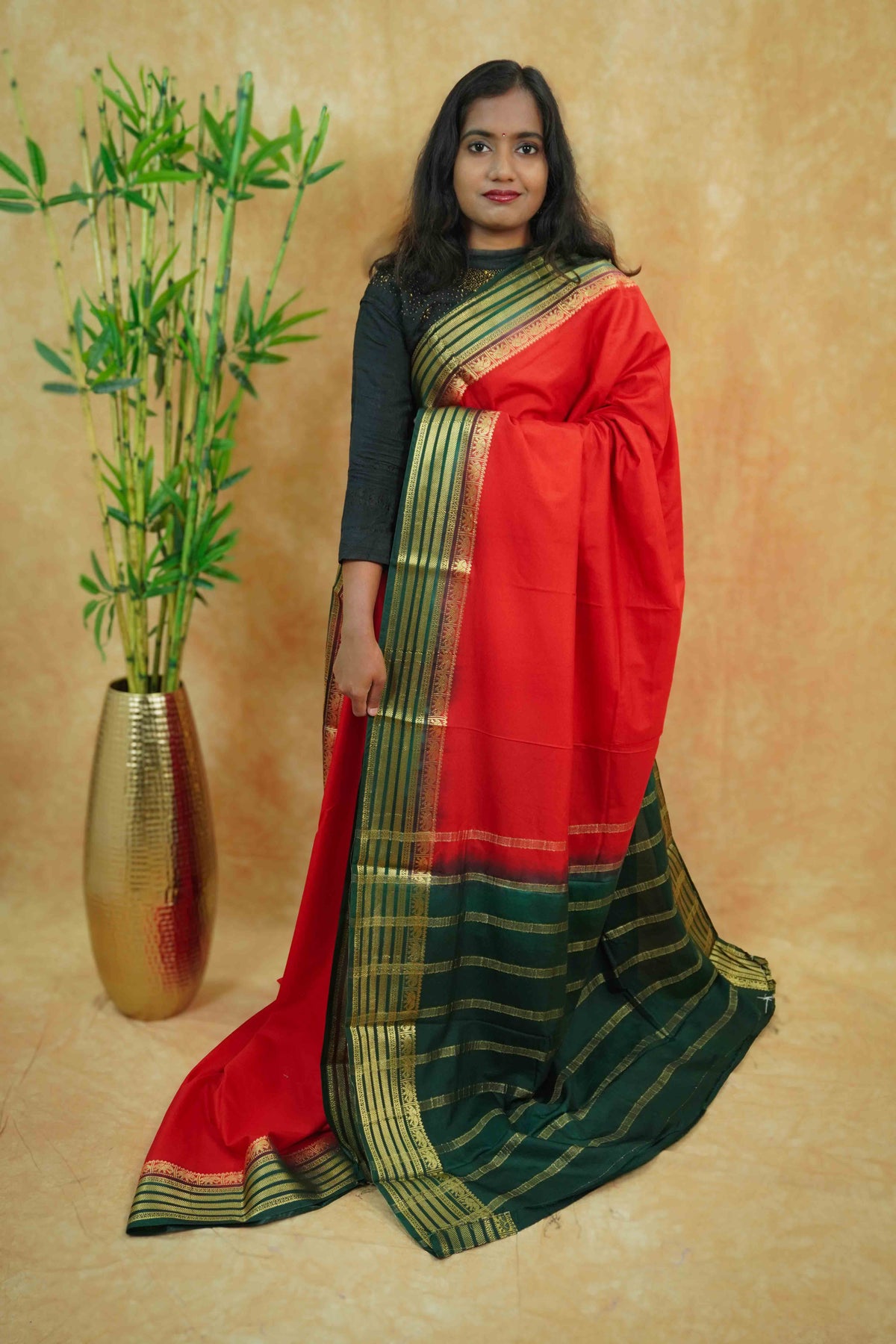IS6112 Red and Bottle Green Georgette Viscose saree with floral gold zari border.