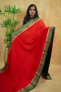 IS6112 Red and Bottle Green Georgette Viscose saree with floral gold zari border.