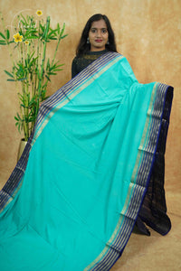 IS6113 Seafoam Blue and Navy-Blue Georgette Viscose sareewith floral gold zari border.