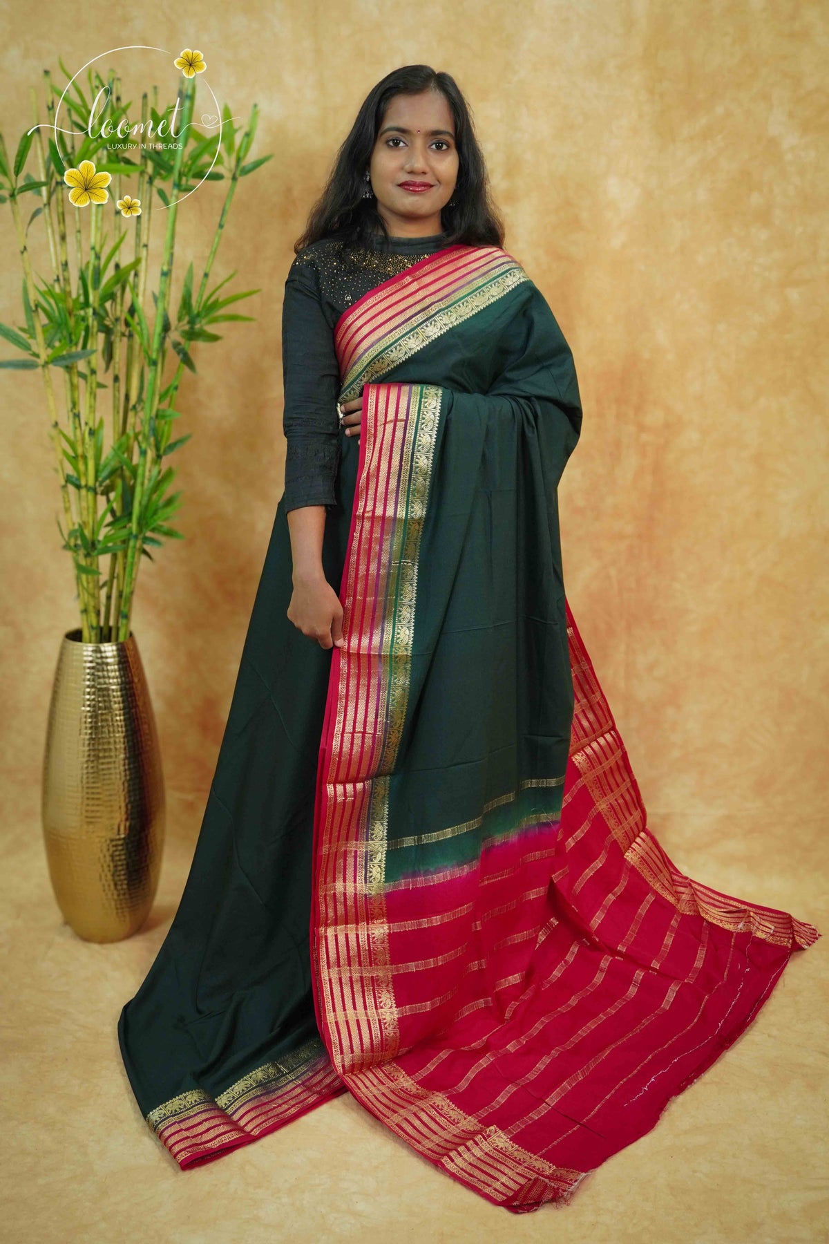 IS6115 Bottle Green and Rani Pink Georgette Viscose saree with floral gold zari border.