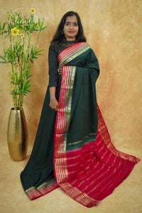 IS6115 Bottle Green and Rani Pink Georgette Viscose saree with floral gold zari border.