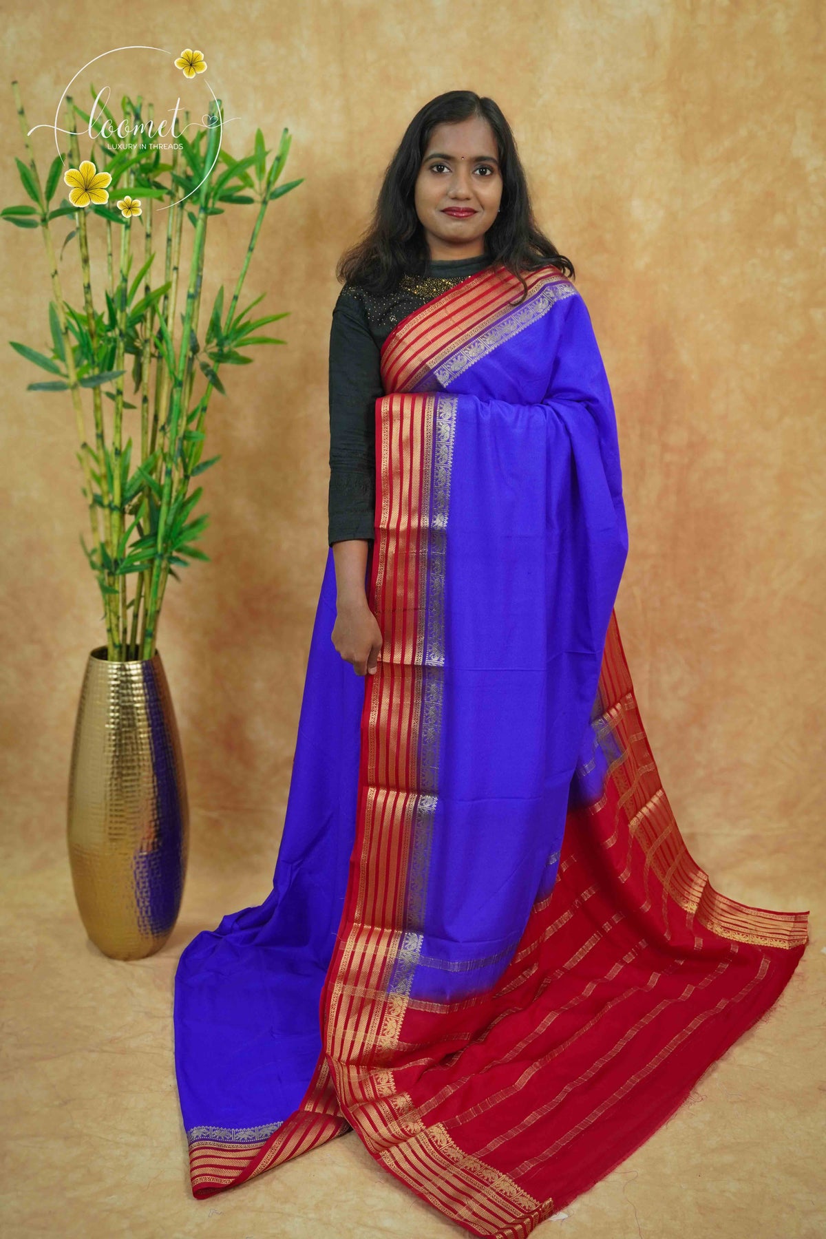 IS6116 Electric Blue and Crimson Red Georgette Viscose saree with floral gold zari border.